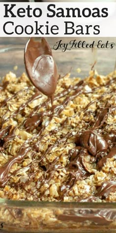 a glass baking dish filled with keto samoa cookie bars and chocolate drizzle