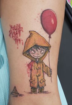 a little boy with a red balloon tattoo on his leg that says, you'll float it