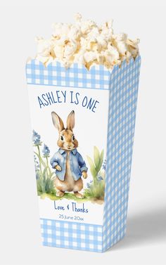 a blue and white box filled with popcorn