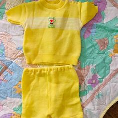 Adorable Bright Happy Yellow Sweater & Shorts Set. There Are 3 Buttons On The Shoulder To Ease On/Off. Made By Little Lamb, Fits 12 Mos. Made In Japan. Cute Stitched Green Frog On Center Chest. Subtle White Stripes Across Short Sleeved Sweater. Elastic Waist On Shorts. Like Brand New Condition. *Shown On A Listed Blanket That Makes Them The Perfect Pairing. Thank You :) Fitted Yellow Shorts For Loungewear, Cute Yellow Short Sleeve Clothing Sets, Cute Yellow Sets With Short Sleeves, Cute Yellow Set With Short Sleeves, Playful Yellow Short Sleeve Sets, Cute Yellow Short Sleeve Sets, Cute Yellow Shorts For Playwear, Cute Yellow Shorts For Play, Cute Yellow Bottoms For Playwear