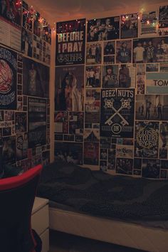 a bed room with a lot of pictures on the wall