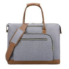 a large gray bag with brown straps