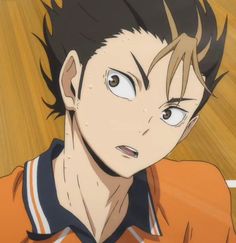 an anime character with black hair and blue eyes looking at the camera while wearing an orange shirt