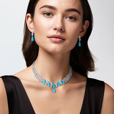 A breath-taking piece that combines bold design with exquisite detailing. The stunning necklace features light blue, pear shaped stones, each set to capture and reflect light beautifully. Intertwined with dazzling ice white Diamondeau®, flawless simulated diamond, the intricate swirls create a captivating interplay of sparkle and color. Complete your look by pairing this necklace with the matching earrings, ensuring an unforgettable appearance. Ice Necklace, Arctic Ice, Guitars For Sale, Automatic Watches For Men, Feature Light, Gold Collection, Stunning Earrings, Pendant Rings, Stunning Necklace