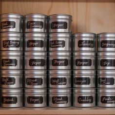 many tins are stacked on top of each other