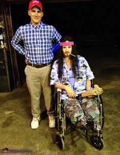 a man standing next to a woman in a wheelchair