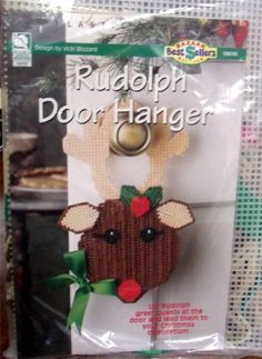 the front of a package for rudolph door hanger