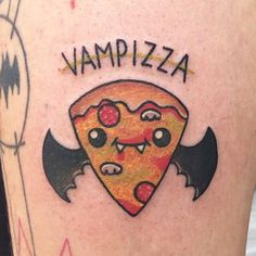 a close up of a person's leg with a tattoo on it that says, vampire pizza