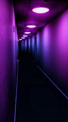 an empty hallway with purple lights and the words you never meet in place last time