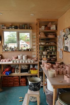 a room filled with lots of pots and bowls