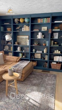 a living room filled with furniture and bookshelves next to a rug on the floor