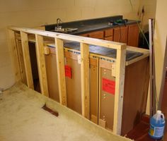 the unfinished kitchen counter is being built and ready to be used as a sink area