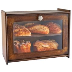 an image of breads in a glass case on the side of a cabinet for display