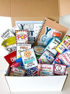 a box filled with lots of different types of candy