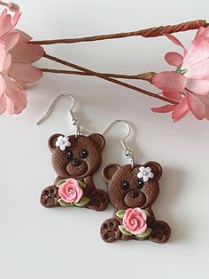 Cute brown bear earrings holding a pink rose with silver micro beads, and they are adorned with a white daisy on the head. They are very cute in real, and so lightweight that it is so easy to use everyday. Perfect for any occasion, style or outfit.  The earrings are made of polymer clay. Though polymer clay is a sturdy material, I still suggest to handle your earrings with care. The earrings are similar but not the same as it is handmade. There will be flaws in the clay, dainty imperfections, du Cute Clay Drop Earrings, Cute Polymer Clay Earrings For Valentine's Day, Cute Pink Polymer Clay Earrings, Cute Brown Earrings Gift, Cute Brown Earrings As Gift, Cute Brown Earrings For Gift, Cute Brown Dangle Earrings, Cute Polymer Clay Flower Earrings For Gifts, Cute Polymer Clay Flower Earrings