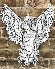 an angel sticker on the side of a brick wall in front of a brick wall