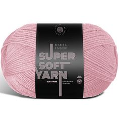 the knitting yarn ball is pink and has a black label on it that says, super soft yarn