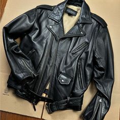 Early 2000s Banana Republic Cafe Racer Style Genuine Leather Jacket. Satin Sleeve Liners. Perfect Condition. Very Slight Pigment Wear On Sleeve But Adds Great Character. Pit To Pit: 21.5" Shoulder To Shoulder: 19" Sleeve Length 23". Length: 23". Waist: 17". Bust: 20".All Buttons And Zipper Work Perfectly. Thanks For Looking! Cafe Racer Style, Coats Vintage, Genuine Leather Jackets, Early 2000s, Black Tan, Black And Tan, Cafe Racer, Bananas, Banana Republic