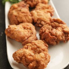 some fried food is on a white plate