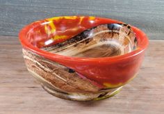 two bowls sitting on top of a wooden table