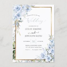 a wedding card with blue flowers and greenery on the front, in gold foil