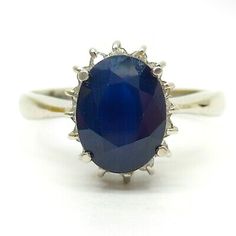 an oval blue stone ring with silver accents