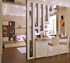 an open concept kitchen and dining room with white walls, wood flooring and beige furniture