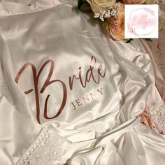 Lilly's Little Gift Co. Bridal Robes These stunning Bride, Bridesmaid, Maid of Honour, Mother of the Bride and Bridesman, robes are available in 7 different colours and 4 different designs which make a perfect accompaniment to start your wedding in style whilst getting ready added with detailed floral trim on the arms and around the edge of the robe, you and your bridal party will look stunning, and these robes will form part of the wonderful memories of a special day. You can request any name or role as I will work with you to get the finished look you are after. ROBE DETAILS Robes are available in 2 different sizes - UK size 6-16 & UK size 18-22. If you would like measurements then please do not hesitate to drop us a message. If there is a specific robe colour, design or vinyl colour you Bridesman Robes, Wedding Robes Bridesmaids, Bridal Robes Personalized, White Bridal Robe, Robes Satin, Wedding Dressing, Robe Wedding, Bridal Robe, Wedding Robe