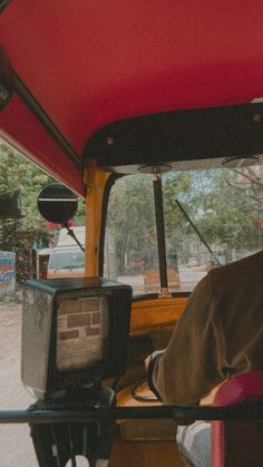 a man sitting in the back of a truck with a tv on it's side