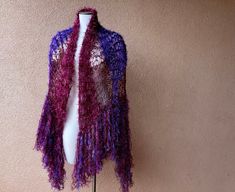 For the Stevie Nicks fan who loves different shades of purple! I designed this piece in the same size, shape, style and design as the concert shawls which I have made for Stevie Nicks. If you seen her in concert, then you have probably witnessed her spinning in my shawl while singing Rhiannon or landslide! Now I've come up with this new color combination, which is a mix of warm burgundy maroon shades and violet purples. Yes there is sparkle in the fringe, unless you request otherwise in message Stevie Nicks Crochet Shawl, Stevie Nicks Shawl, Purple Bohemian Shawl Silk Scarf, Purple Bohemian Scarf One Size, Purple I, Evening Shawls, Bridal Shawl, Purple Bohemian Scarf, One Size, The Concert