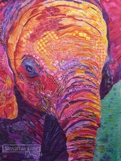 an elephant is painted in bright colors