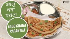 two flat breads on a plate with sauce in the middle and an advertisement for aloo chana parantha