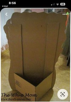 an open cardboard box sitting on the floor