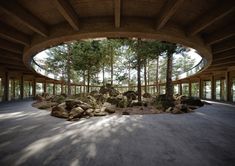 an empty room with rocks and trees in it