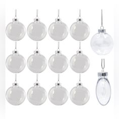 twelve clear glass baubles hanging from the top of each ornament on a white background