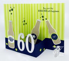 a greeting card with two bottles of beer on it and the number 60 in front