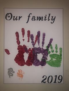 a family handprint with the words our family painted on it