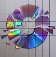 an image of a cd that has been cut into pieces