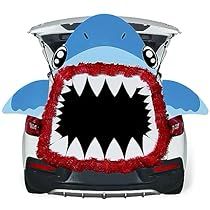 an inflatable shark car decoration on the back of a car with it's mouth open