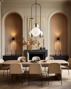 an elegant dining room with beige walls and chairs