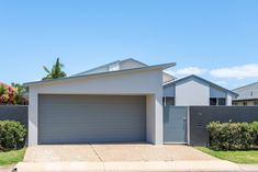 a house with a garage in the front yard