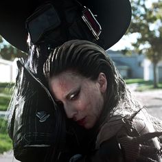 a woman with her head in the back of a car