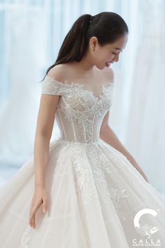 a woman in a wedding dress is smiling