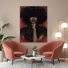 a living room with two pink chairs and a painting on the wall above it that has an afro woman's face