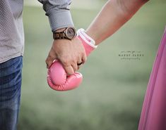 a man and woman holding each other's hand