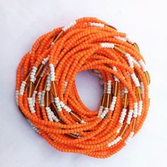 ♕ This Listing is for 20 - 100 Strands of WaistBeads ♕ Wholesale African waist beads. ♕ Ships directly from Ghana, West Africa. ♕ Free shipping via DHL (3 - 5 business days to arrive). ♕ Processing time (5 - 7 business days). ♕ Beads are all TIE-ON (made with cotton thread/polyester). ♕ Length varies from 45 to 50 inches. Orange Beaded Bracelets, African Waist Beads, Women Waist, Waist Beads, Beads Wholesale, Belly Chain, Czech Beads, Wholesale Beads, West Africa