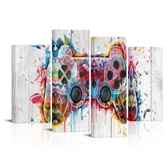 a video game controller painted in multicolors on white wood paneled wall art