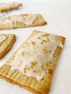 some kind of pastry with icing on it sitting on top of a white table