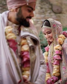 a man and woman standing next to each other