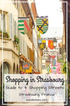 a street lined with buildings and flags that read shopping in strassong guide to 4 shopping streets